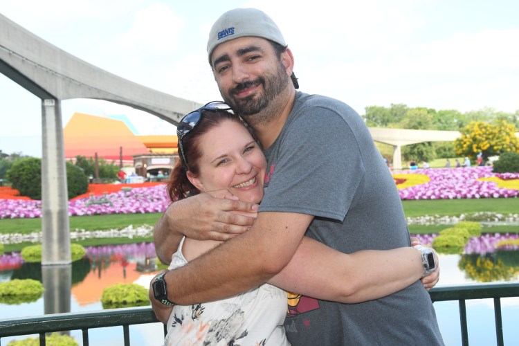 Catherine and her husband hugging in Epcot
